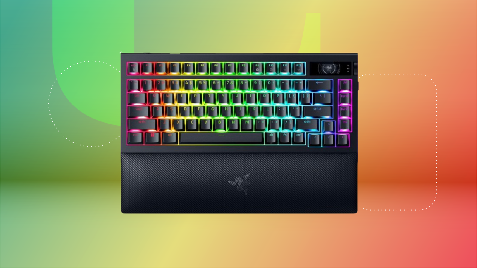 Black gaming RGB wireless keyboard with wrist rest against green, yellow and red-orange CNET background.