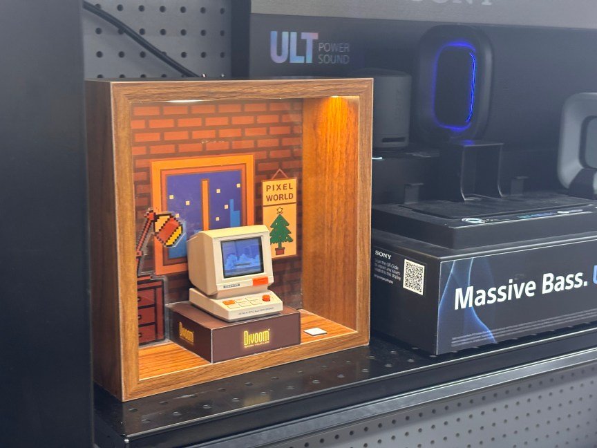 A small 3D printed computer sits on a shelf at a retail store.